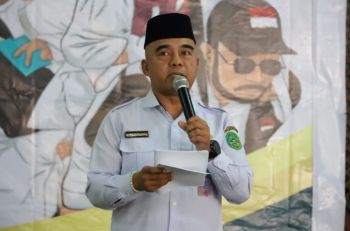 Asisten I Setkab Kukar, Akhmad Taufik Hidayat membuka Manasik Haji Massal 2025.