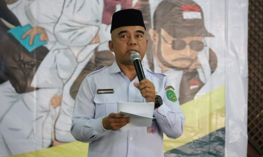 Asisten I Setkab Kukar, Akhmad Taufik Hidayat membuka Manasik Haji Massal 2025.